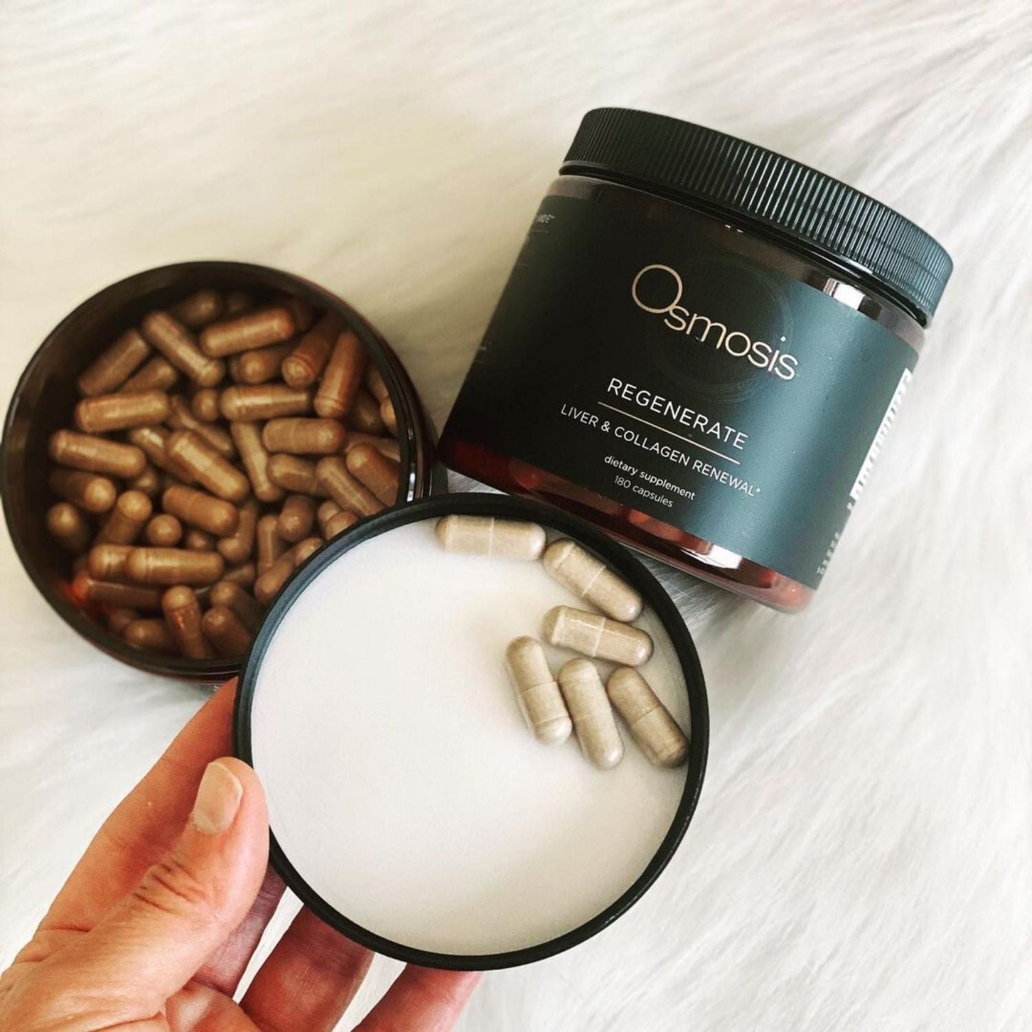 Osmosis Wellness Regenerate supplement container with capsules on a white surface