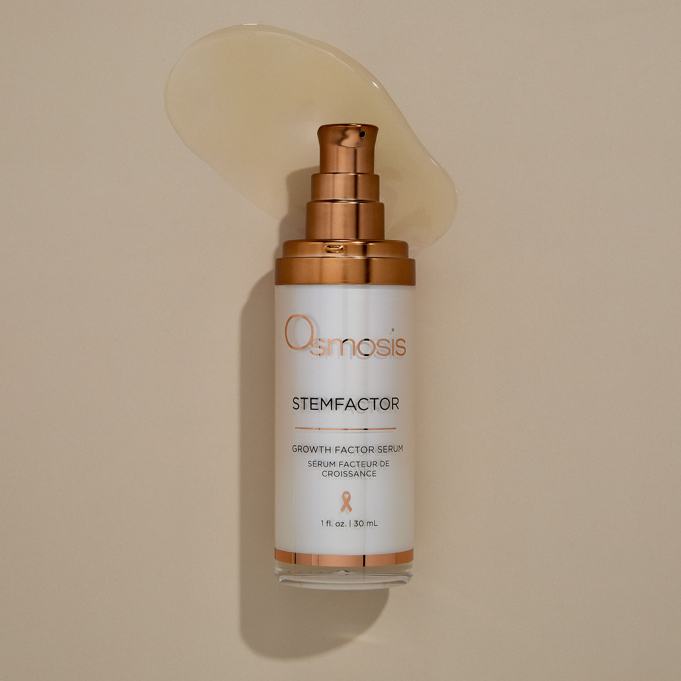 Osmosis stem factor serum bottle on a beige background