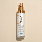 Osmosis Balance Botanical Activating Mist bottle on a beige background
