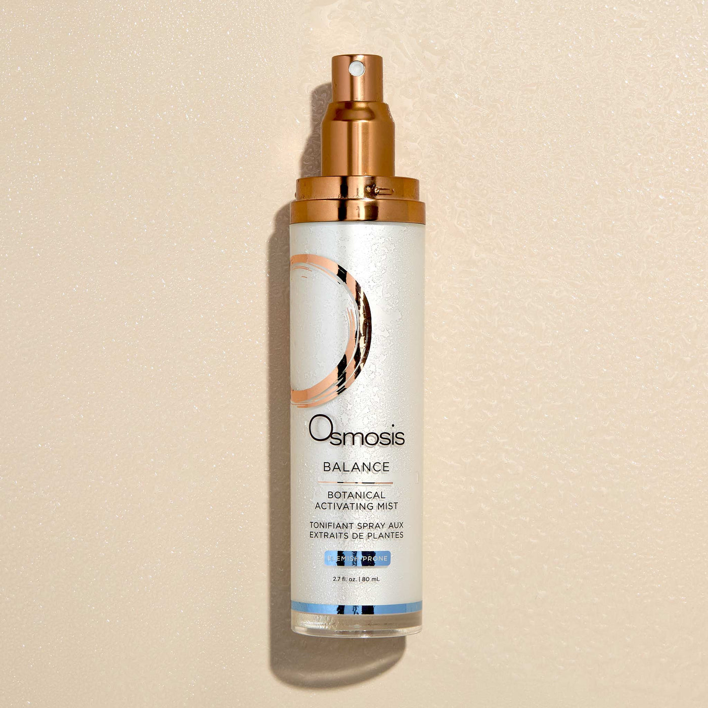 Osmosis Balance Botanical Activating Mist bottle on a beige background