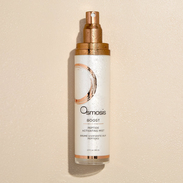 Osmosis peptide activating mist bottle on a beige background
