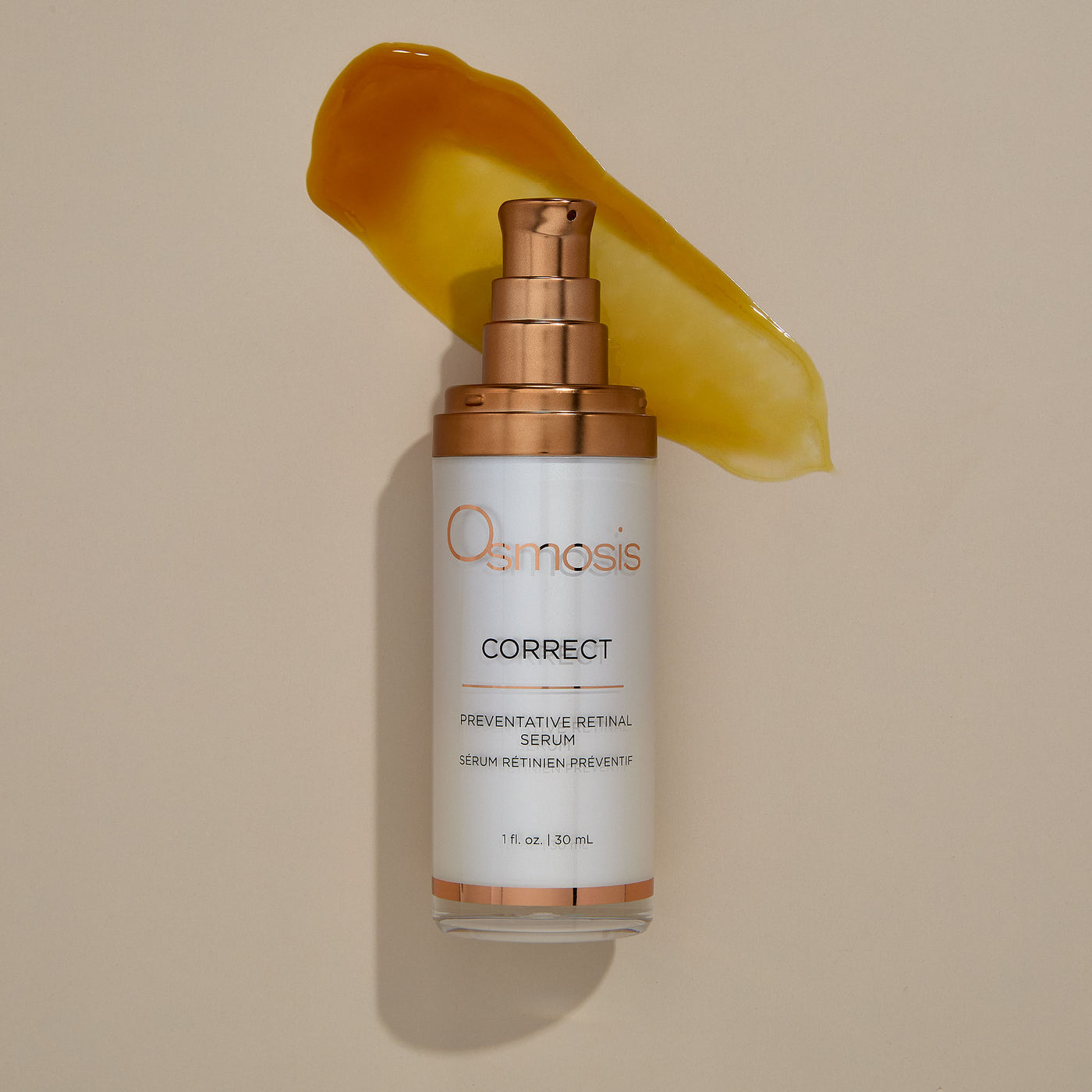 Osmosis Correct preventative retinal serum bottle with gold product smear on beige background