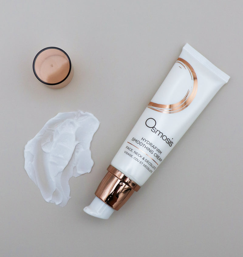 Osmosis Hydrafirm product with cream and applicator on a neutral background