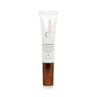 Illuminate eye and lip treatment tube with gold cap and gold cap on a white background