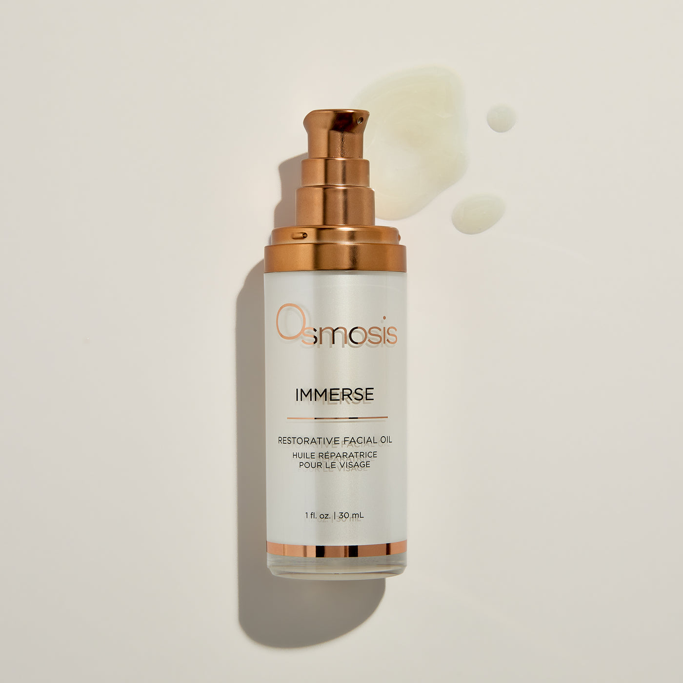 Osmosis Immerse restorative facial oil bottle on a beige background