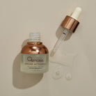 Osmosis immune activator bottle with dropper on a beige background