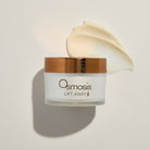 Osmosis Lift Away skincare product with a gold lid on a light background