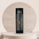 Pure lip balm container with product details on a beige background