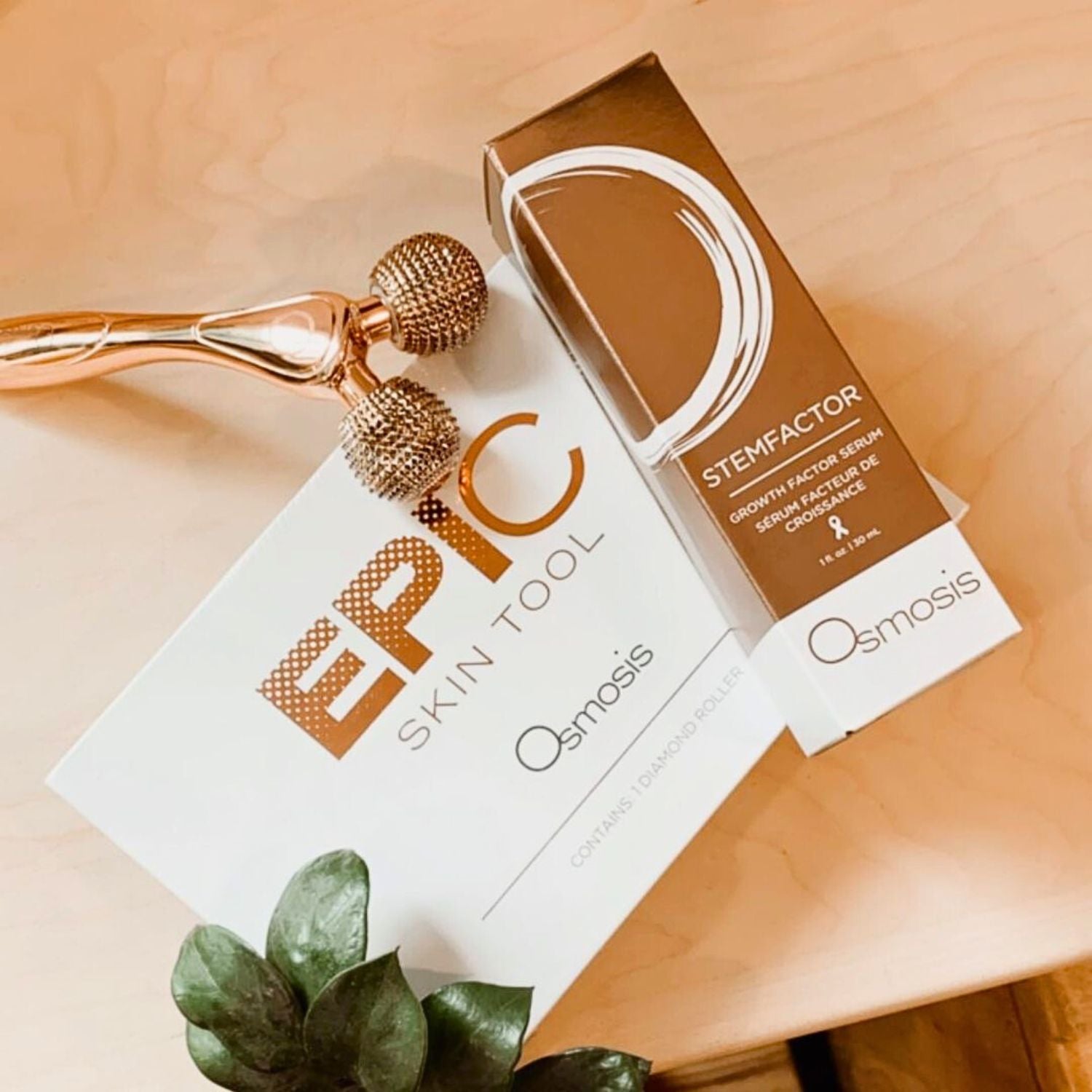 epic skin tool atop product box and Osmosis Stemfactor product box