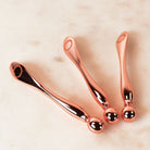 Three mini multi tool displayed on beige background