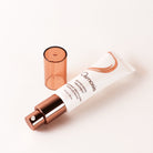 Osmosis+ skincare bottle with rose gold cap on a white background